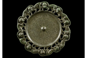  Buckle with 10 monkeys in relief, Chinese, Western Han Dynasty, 206 B.C.—9 A.D. Courtesy of Phoenix Ancient Art 